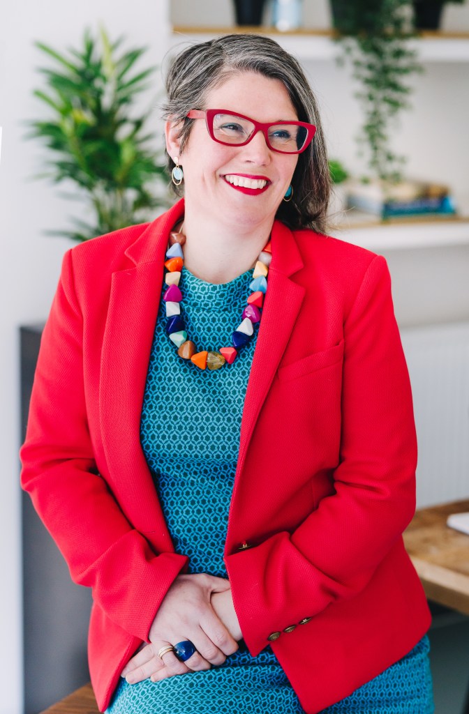 Founder Anna Denton-Jones in a red blazer