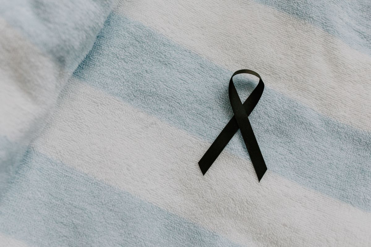 Black ribbon on a striped fabric background